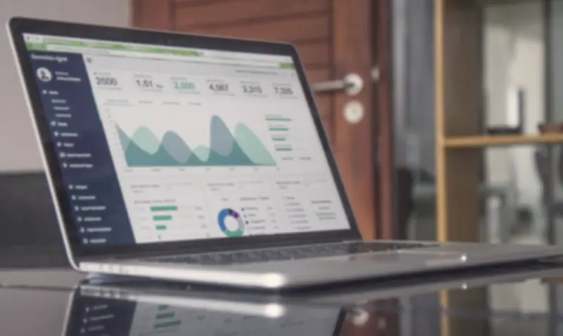 A laptop showing charts