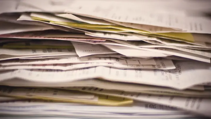 A pile of receipts and paperwork