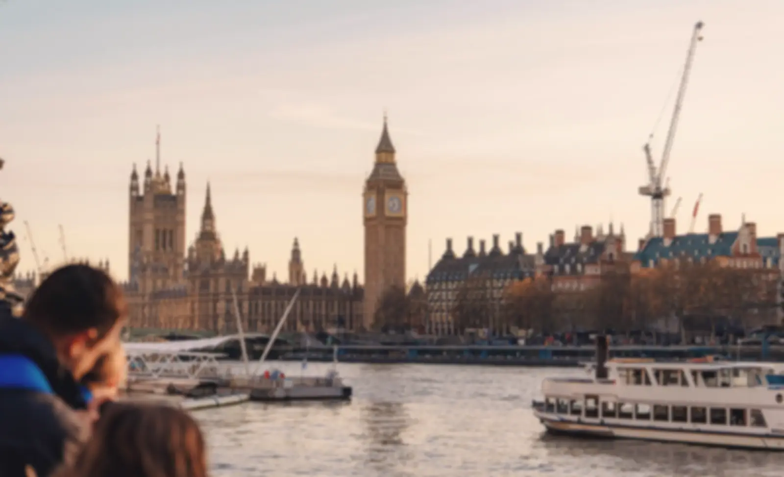 The Houses of Parliament and Big Ben across the River Thames at sunset